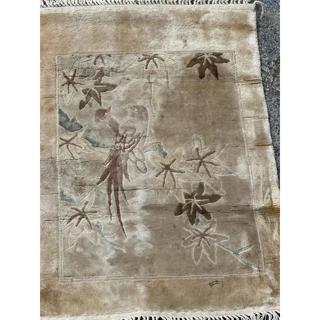 Pretty vintage Chinese rug with a design of birds and nice light colours, entirely and finely hand knotted with silk on...