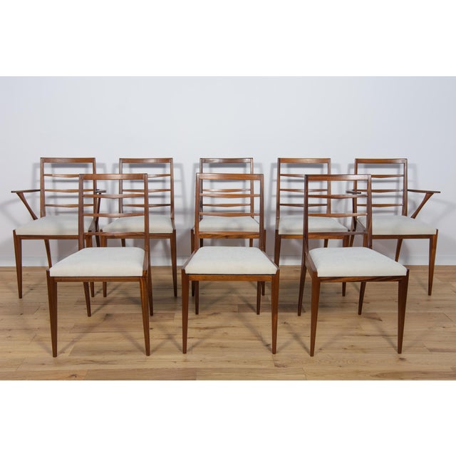 Set of six chairs and two armchairs produced by McIntosh in the United Kingdom circa 1960. The foams have been replaced...