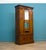 An Edwardian mahogany wardrobe or hall robe featuring a central mirrored door flanked by decorative Art Nouveau inlaid...
