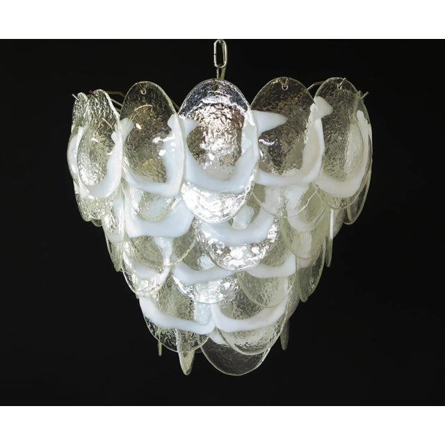 This is an Italian Murano chandelier made with 41 glass leaves in a chrome frame. The Murano glass is blown in a...