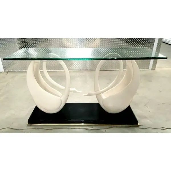 Featured is a luxurious authentic Maison Jansen console composed of two swans in composite of ivory color posed on a base...