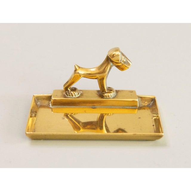 A stylish antique early 20th Century Art Deco English cast brass terrier dog catchall tray or vide poche. Lovely brass...