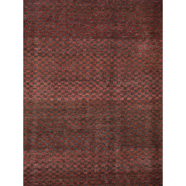A vintage Turkish Anatolian carpet from the second quarter of the 20th century with a checkerboard pattern in maroon and...