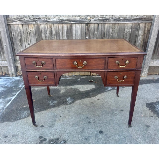 Elegant and timeless English mahogany kneehole writing desk dating to the late Victorian / early Edwardian period (circa...
