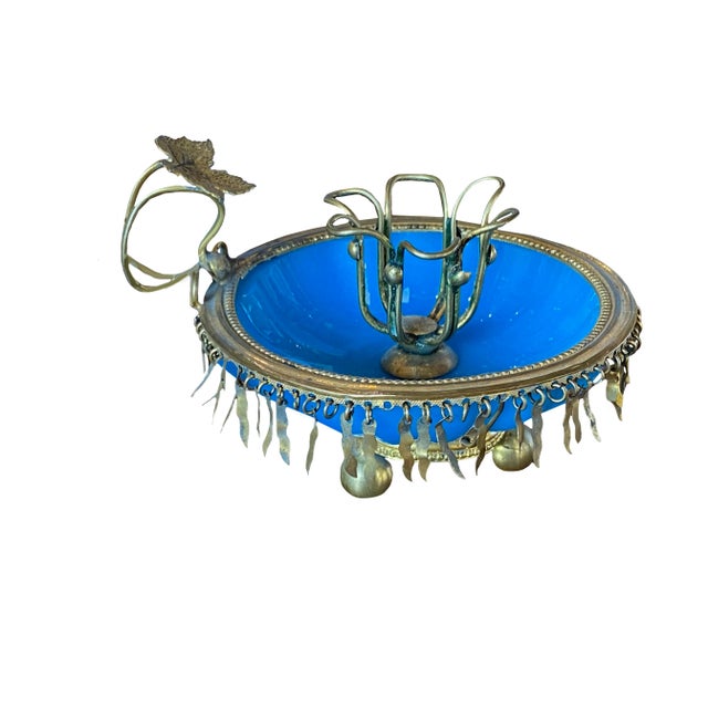 An antique French blue opaline candle holder with fringe gilt.