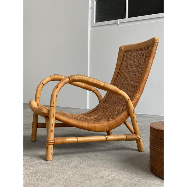 Very beautiful and rare ARCO rattan and bamboo armchair in an exceptional design and shape in top original condition,...