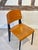 A rare and iconic mid-century French "Metropole 305 / Standard Chair," designed by Jean Prouvé, in black lacquered metal...