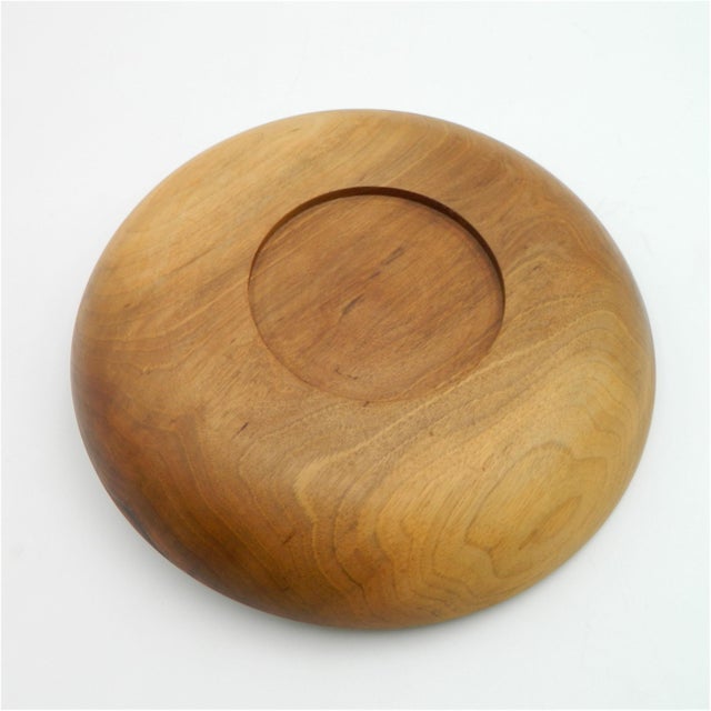 A walnut fruit bowl, model 4640, with six raffia-handled paring knives from the Auböck workshop in Vienna. It consists of...