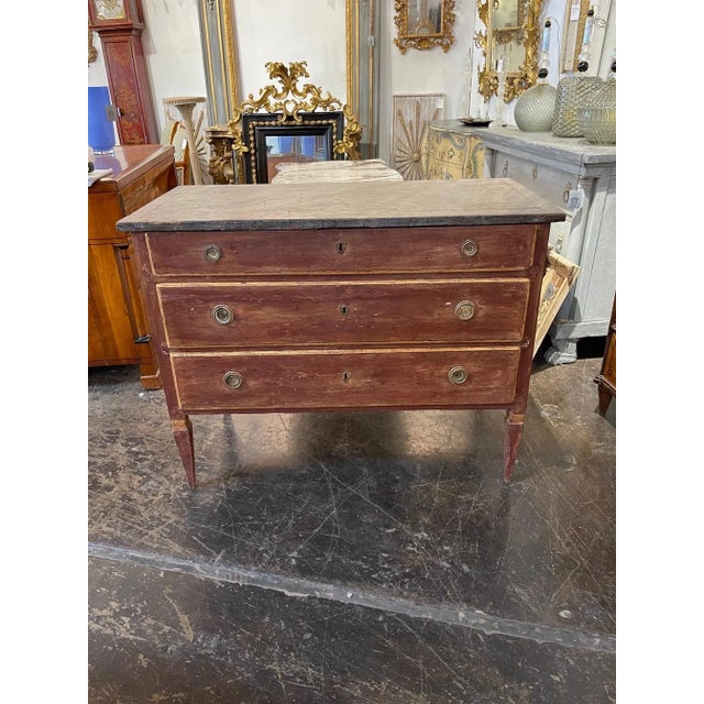 Late 18th century Italian painted neo-classical style commode. Rusty red color with a painted grey top. A handsome piece!