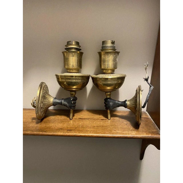 1930's Pair French Art Deco Patinated Bronze Light Bearer Fist Wall Sconces. By Andre Arbus.