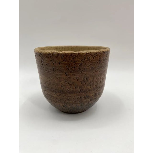 *a flower potion *West German ceramics of the post -war period *around 1960 *glazed ceramic *with two holes to hang the...