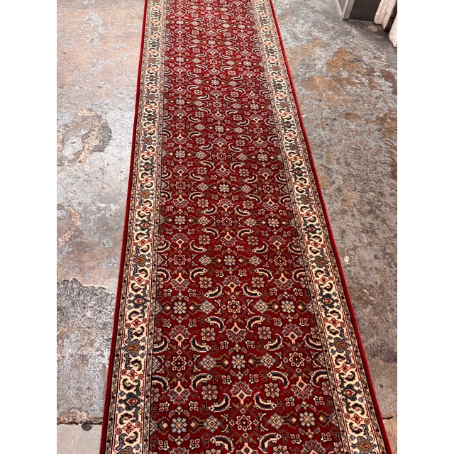 Design Plus Gallery presents a 2ft 6in × 19ft 10in Traditional Floral Runner Rug. The burgundy field displays repeating...