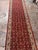 Design Plus Gallery presents a 2ft 6in × 19ft 10in Traditional Floral Runner Rug. The burgundy field displays repeating...