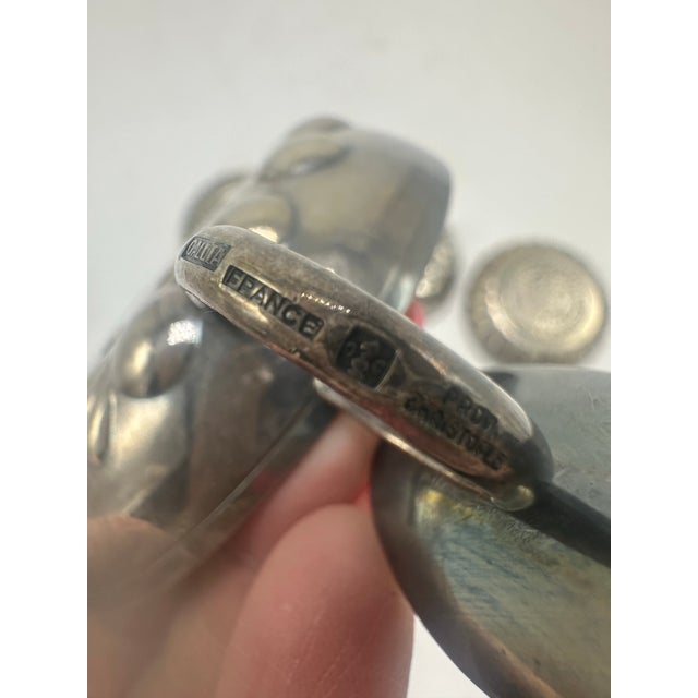 These are wine tasters, also known by the French name tastevins. They’re small silver (or silver-plated) shallow cups...