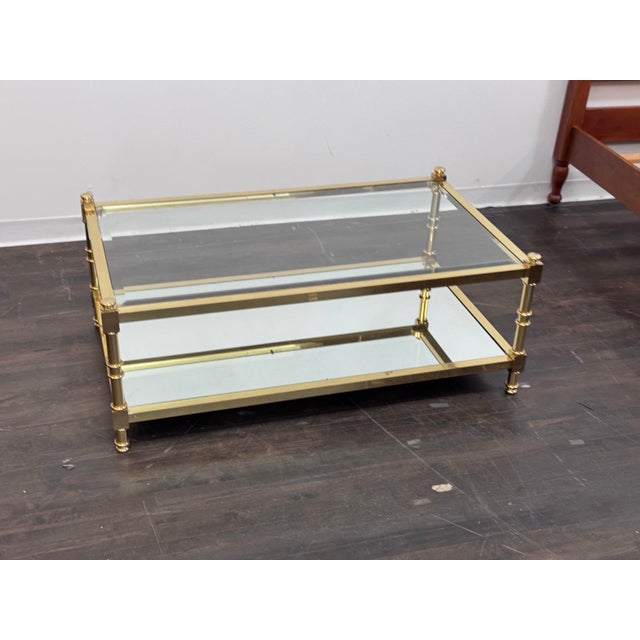 Design Plus Gallery presents a Circa 1970's Coffee Table. This Italian two-tiered coffee table embodies the glamour and...