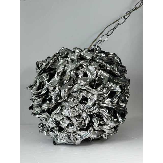 We are very pleased to offer a striking brutalist pendant light, circa the 1980s. This piece features an intensely...