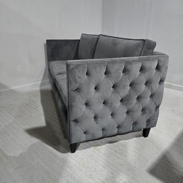 A super quality high sided sofa with buttons, covered in blue velvet, in excellent condition. 80" length 35" depth 34"...