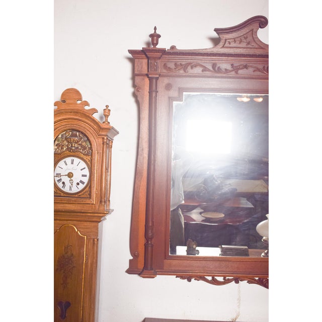 This impressive 19th-century mirror is crafted in wood and designed in the Empire style, reflecting the grandeur and...