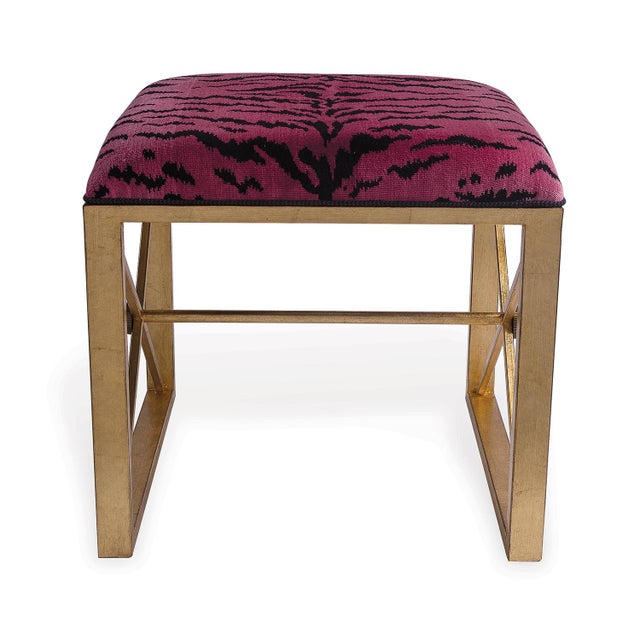 The Medallion Gold Single Bench is shown with Scalamandre's chic "Le Tigre Red" velvet. The color of the velvet has a...