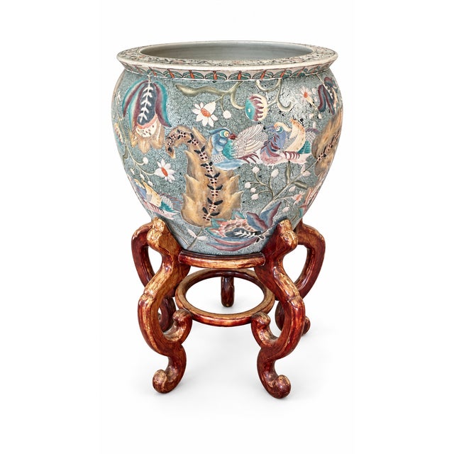 Striking large Chinese porcelain jardinière or fishbowl planter featuring colorful bird, floral, vine, and foliate...