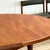 A refined expression of mid-century craftsmanship, this round extending dining table with four chairs was designed by Tom...