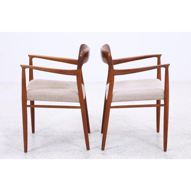 Set of two iconic No. 56 armchairs by Niels Otto Møller for J.L. Møllers. The organically shaped armrests, the elaborate...