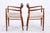 Set of two iconic No. 56 armchairs by Niels Otto Møller for J.L. Møllers. The organically shaped armrests, the elaborate...