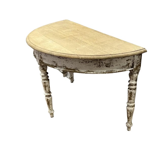 Lovely pair of 19th C Italian console tables, featuring painted bottoms, and bleached wood tops. This beautiful pair are...