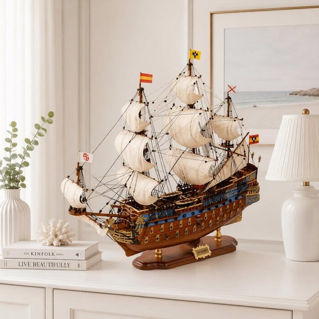 Add a touch of sophisticated history to your home or office with this exquisite, handcrafted wooden ship model....