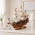 Add a touch of sophisticated history to your home or office with this exquisite, handcrafted wooden ship model....
