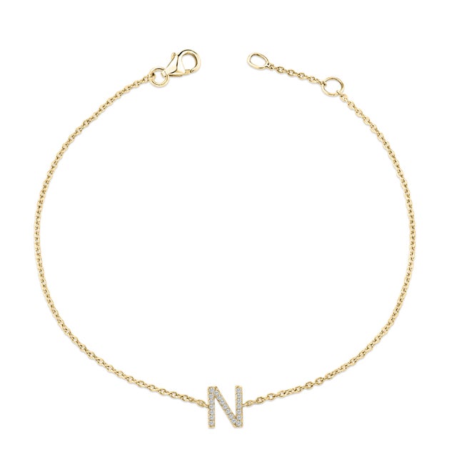 Immerse yourself in the understated elegance of this 10K yellow gold bracelet, for an enrapturing shimmer that captures...
