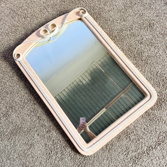 A sculptural gem of 1990s design, this Postmodern wall mirror features soft pink tessellated stone framed by elegant...