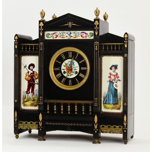 An elegant Antique French black marble and hand-painted clock garniture set, retailed by Palmer Bachelder & Co. of Boston...