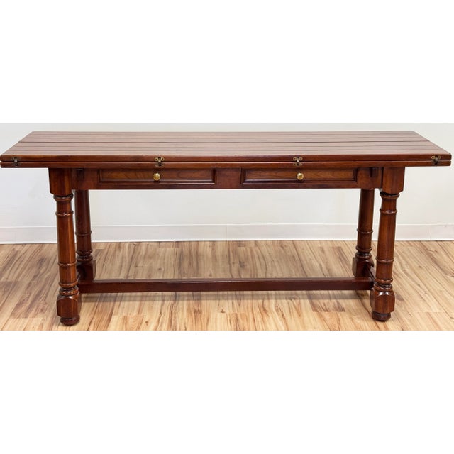 Designed for function and versatility! Stately turned wood legs and stretcher base are topped by gorgeous plank wood top....