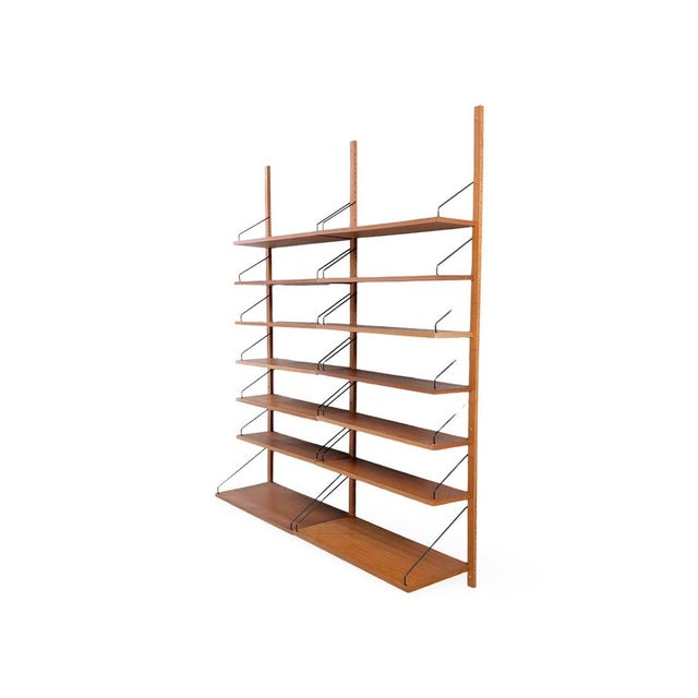 We are offering a beautiful, large wall shelf from the traditional Danish manufacturer Cado, dating from the 1960s, for...