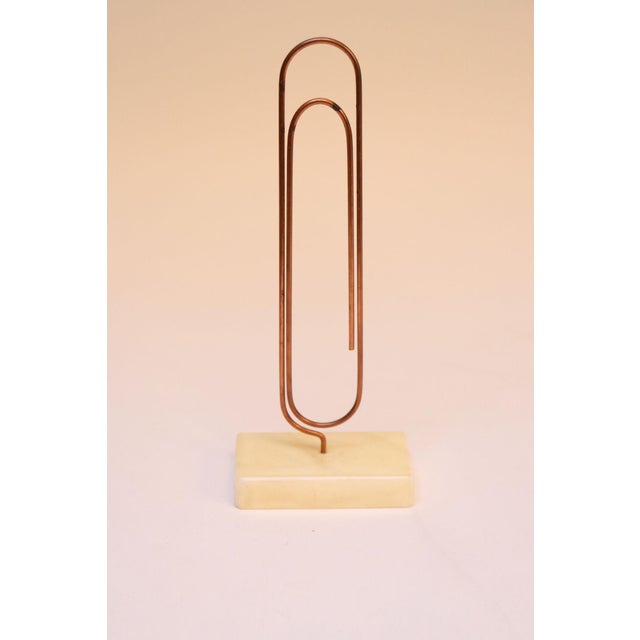 Oversized copper paperclip mounted to marble base by Sculptura of California, circa 1970s. Can be used a stand alone...