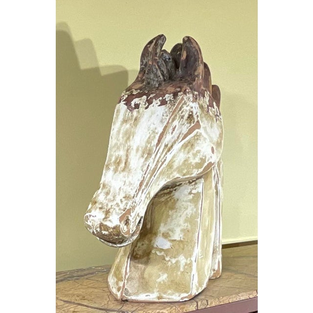 Bring a touch of timeless elegance and rustic charm to your home with this beautiful mid-20th century terracotta horse...