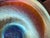 Stunning iridescent trumpet vase, 12" tall, in rich blues and iridescent with flowing swirl design and gold stars,...