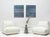 A deep, moody blue-green fills this two-panel diptych, overlaid with faint interlocking circles and angular line work that...