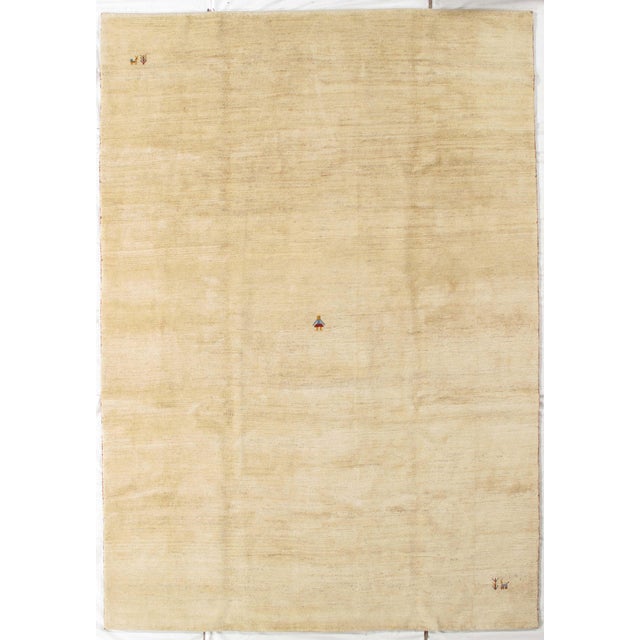 Vintage hand-knotted Persian Gabbeh rug featuring a minimalist field with subtle tonal variation and soft abrash. Gabbeh...