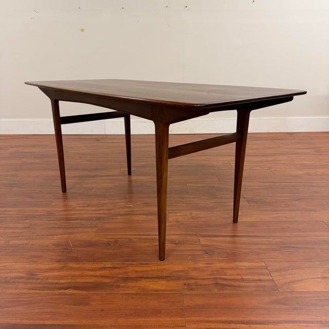 Beautiful vintage dining table by John Herbert for A. Younger Ltd., made in the U.K. circa the late 1950's. This is a...