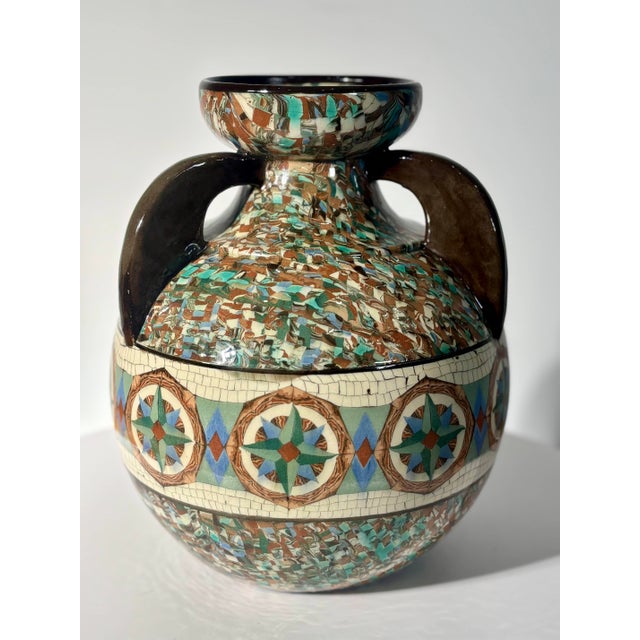 An exceptional and rare three-handled vase created by master ceramist Jean Gerbino. This piece is a masterful testament to...