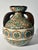 An exceptional and rare three-handled vase created by master ceramist Jean Gerbino. This piece is a masterful testament to...