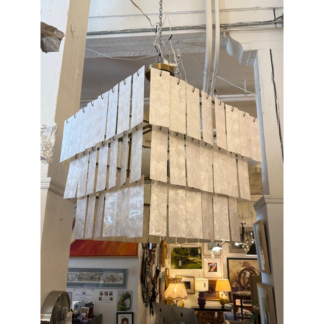 Design Plus Gallery presents the Celina Capiz Chandelier from CB2. The piece was designed by Barcelona-based Mermelada...