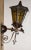 Exceptional pair of antique, early 20th century bronze, exterior wall-mounted lanterns of tapered hexagonal form, with...