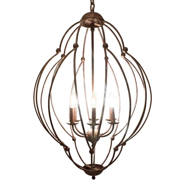 Aged rust finish iron frame chandelier with elegant scalloped form. Timeless classic design with vintage style charm. Six...