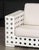 Skyline Design Three-Seat Sofa, woven white plastic framed with beige cushions. 36" H x 95" W x 36" D; seat: 17" H....