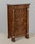An early 19th century French Empire Period miniature semainier chest finished in rich matched flame walnut veneers....