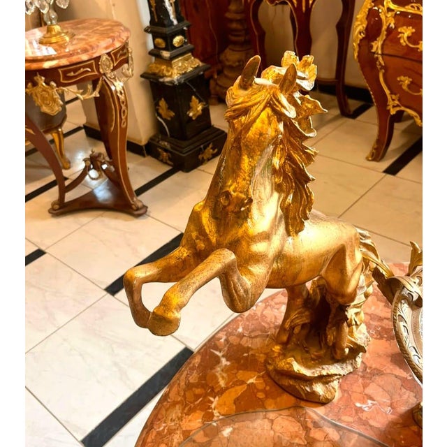 Make a bold statement with this magnificent bronze rearing horse sculpture, a timeless decorative accent that embodies...