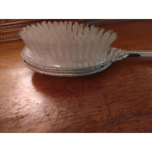 Vintage 3 piece vanity set. The mirror is 14x5x1. The brush is 10 x 3.5 x 2.5". The comb is 8 x 2 x .5. they are a mix of...